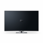 Xiaomi A Pro 2026 55” es un televisor inteligente de color negro con una gran pantalla de 55 pulgadas y biseles muy delgados. El dispositivo está orientado de forma frontal y centrada, mostrando el panel de la pantalla oscuro con el logotipo de Xiaomi en el centro. El televisor se apoya sobre un soporte central metálico de color gris oscuro. El diseño es moderno y minimalista, con líneas limpias y una construcción robusta. No se aprecian botones ni puertos visibles desde esta perspectiva frontal.